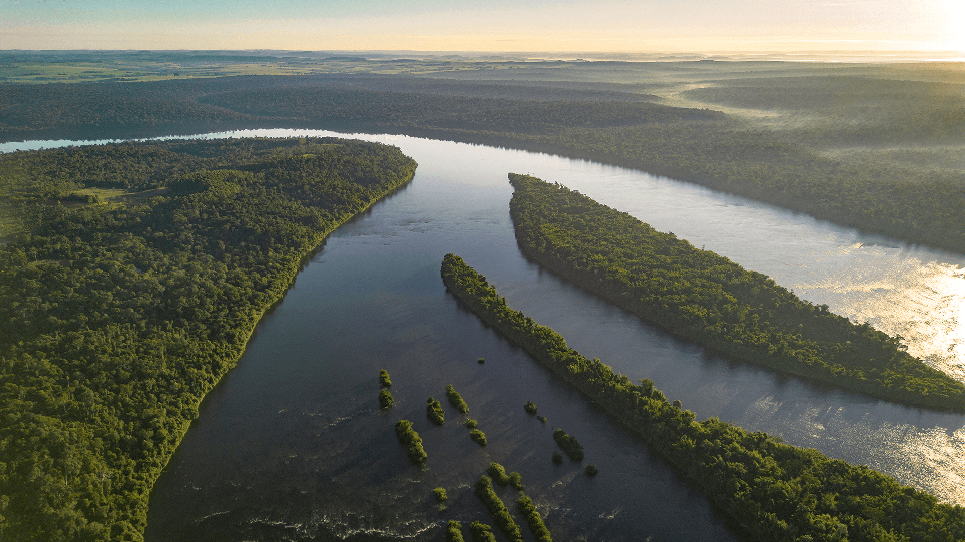 Drone view of Peninsula Andresito (Argentina) directly facing the Iguaçu National Park (Brazil)